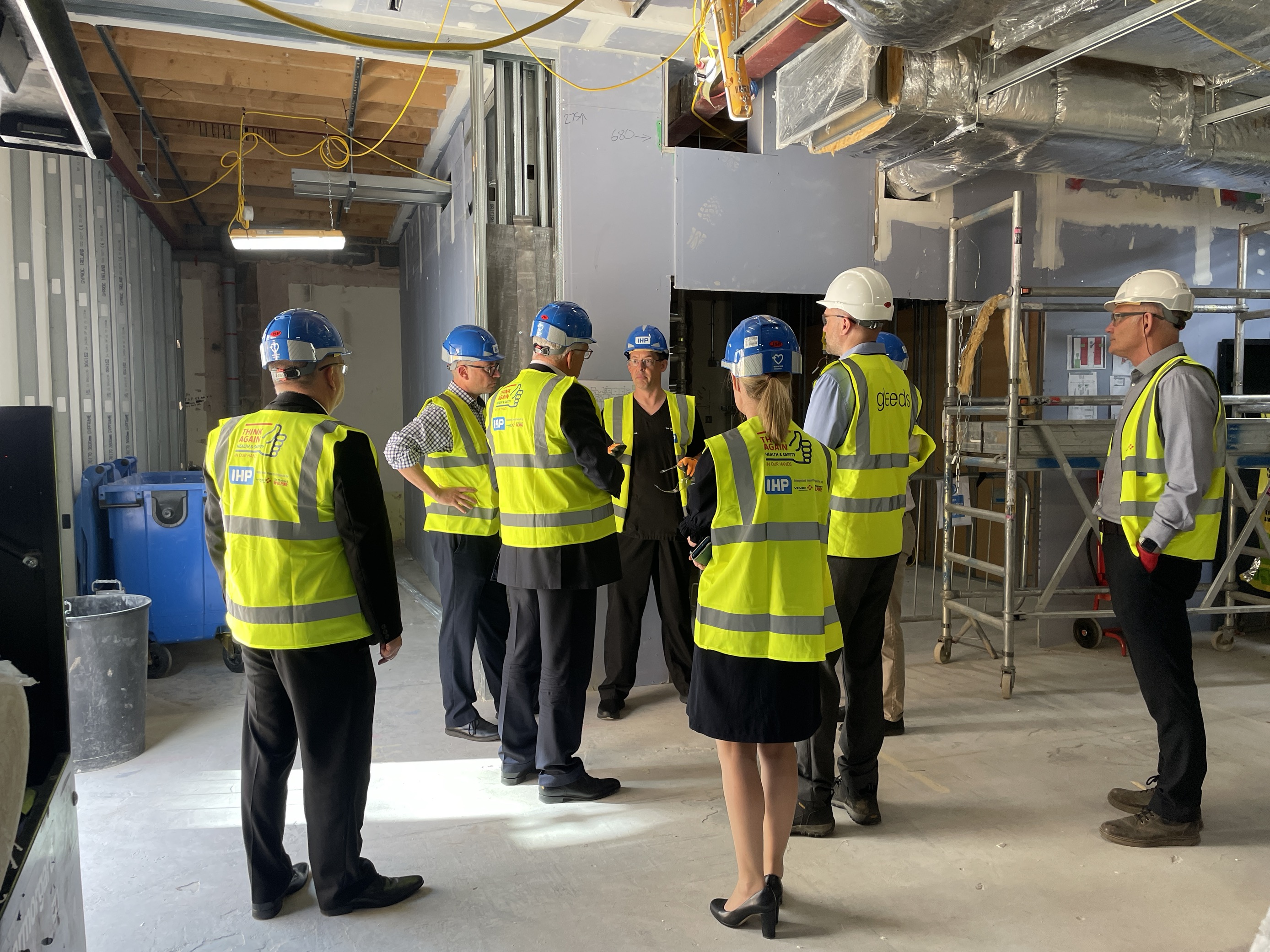 NHS E – Richard Meddings RSH Visit 1 a group of people wearing hard hats in a building site