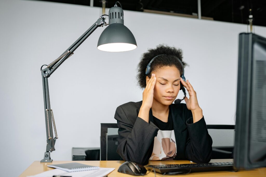 Person working at a desk with Fatigue