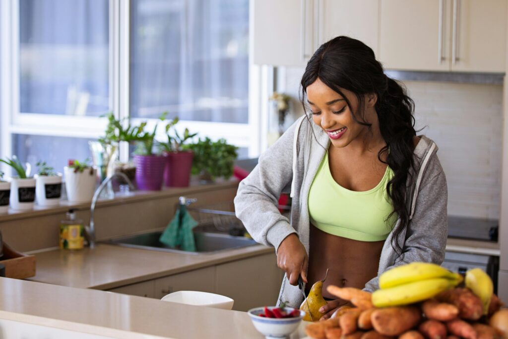 Woman chopping up fruit and veg