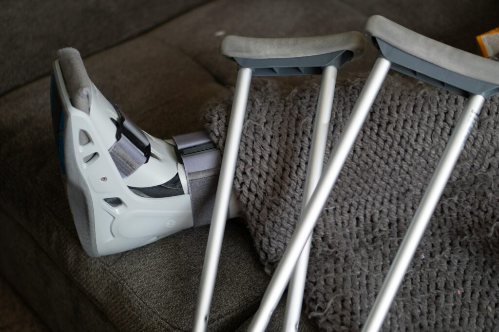 A foot in a support with crutches